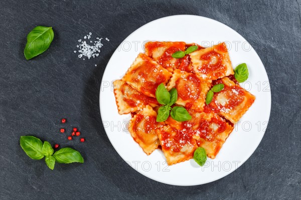 Ravioli Italian pasta eat lunch dish with tomato sauce from top of slate in Stuttgart