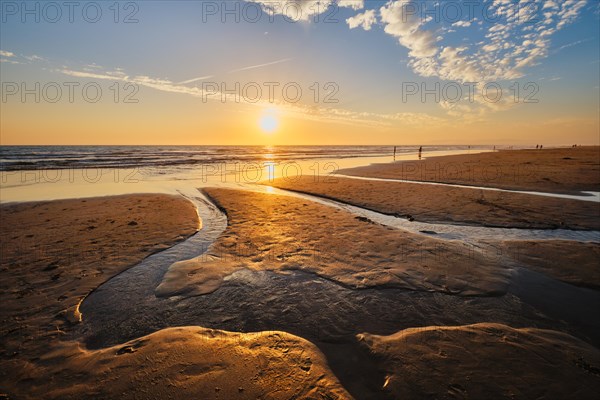 Atlantic ocean sunset with surging waves at Fonte da Telha beach