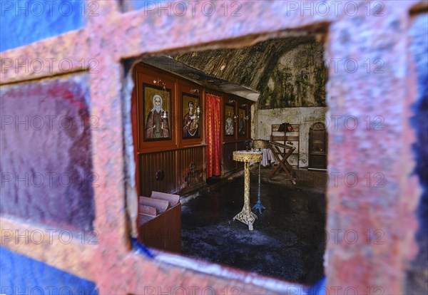 Interior of Orthodox cave church of St John the Hermit in abandoned Katholiko monastery in Avlaki gorge of Akrotiri peninsula