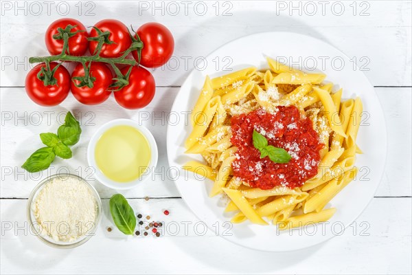 Penne Rigatoni Rigate Italian pasta in tomato sauce eat lunch dish on plate from above in Stuttgart