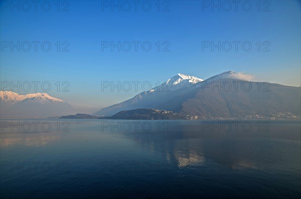 Village on Lake Como with Snow-capped Mountain in Lombardy