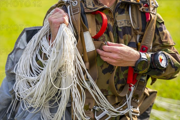 Military Parachuter Holding His Parachute in Switzerland