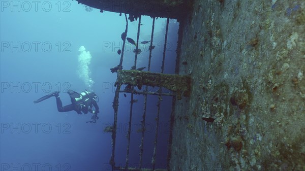 Scuba diver filming deck of ferry Salem Express shipwreck