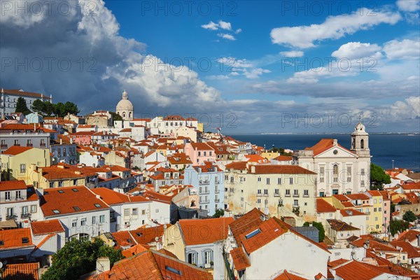 View of Lisbon famous postcard iconic view from Miradouro de Santa Luzia tourist viewpoint over Alfama old city district. Lisbon