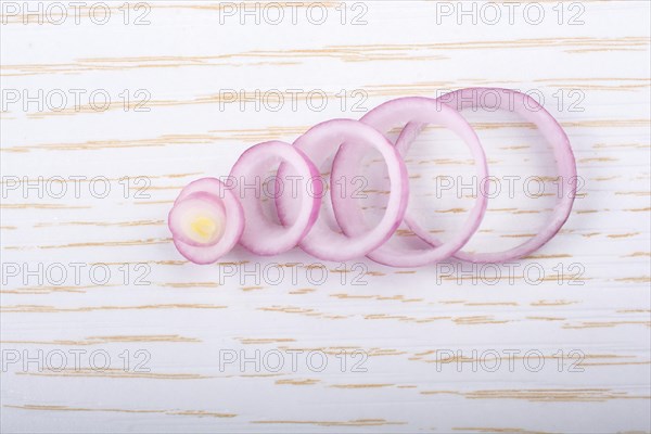 Sliced onion rings and onion slices on the background