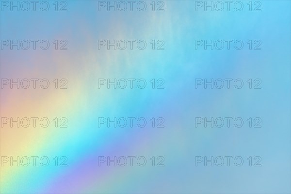 Rainbow colours in the water flow of an agricultural sprinkler system. Bas-Rhin