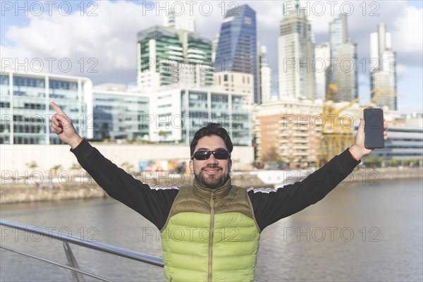 Happy tourist posing in Puerto Madero