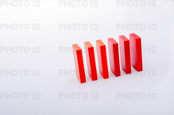 Colorful Domino Blocks in a line on a white background