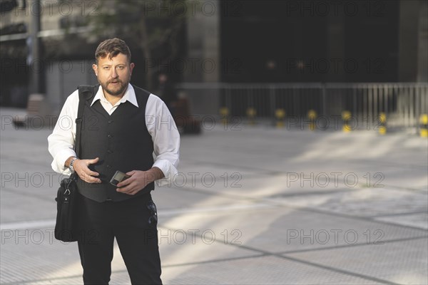 Business man posing on the street