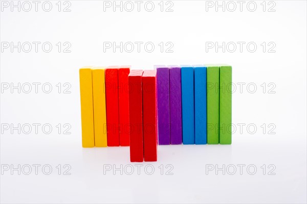 Colorful Domino Blocks in a line on a white background