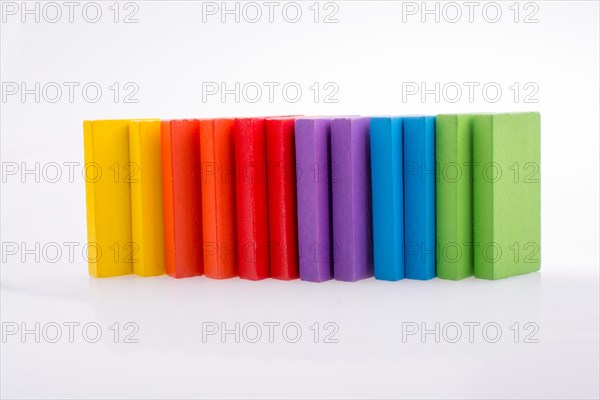 Colorful Domino Blocks in a line on a white background