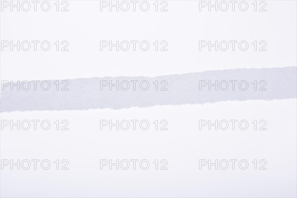 A piece of white blank torn note paper
