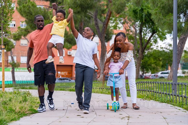 African black ethnicity family with children on playground