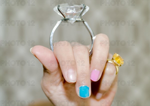 Woman Holding a Big Diamond Ring