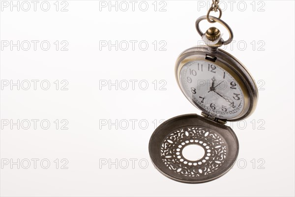 Isolated retro styled pocket watch on white background