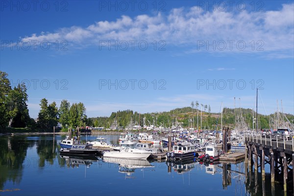 Small fishing boats in calm crystal clear water