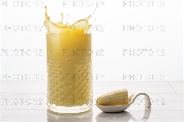 Close up of a banana milkshake with natural bananas