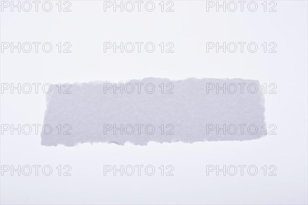 A piece of white blank torn note paper