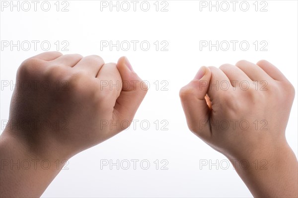 Clenched fists on a white background