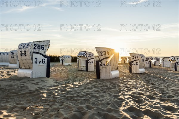 White beach chairs and mudflats