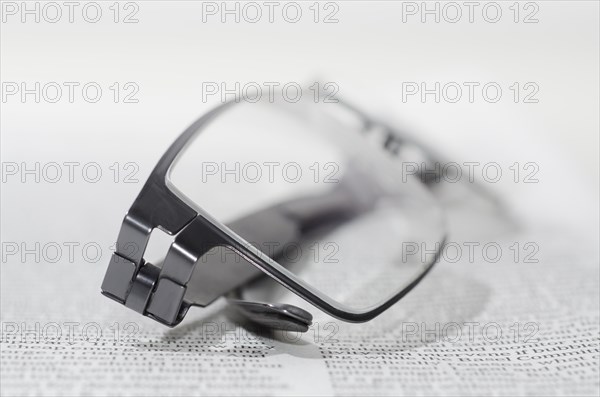 Financial Newspaper and Eyeglasses