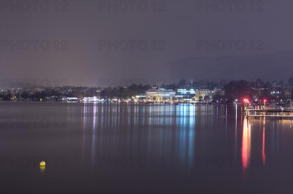 Cityscape at Night with Lake Zurich and Mountain in Switzerland