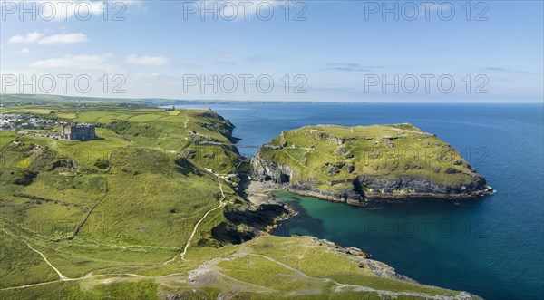 Aerial panorama of the rugged coastline on the Celtic Sea with the Tintagel Peninsula and the ruins of Tintagel Castle