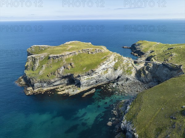 Aerial view of the rugged coastline on the Celtic Sea with the Tintagel Peninsula and the ruins of Tintagel Castle