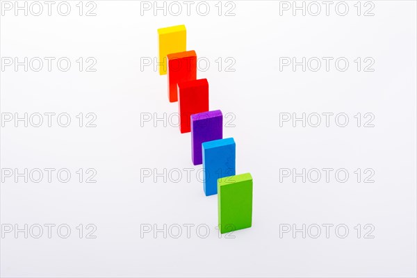 Colorful Domino Blocks in a line on a white background