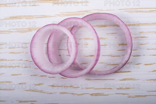 Sliced onion rings and onion slices on the background