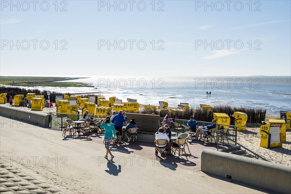 Beach cafe and yellow beach chairs and Wadden Sea
