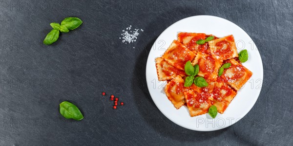 Ravioli Italian pasta eat lunch dish with tomato sauce from above on slate panorama text free space copyspace in Stuttgart