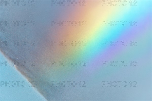 Rainbow colours in the water flow of an agricultural sprinkler system. Bas-Rhin