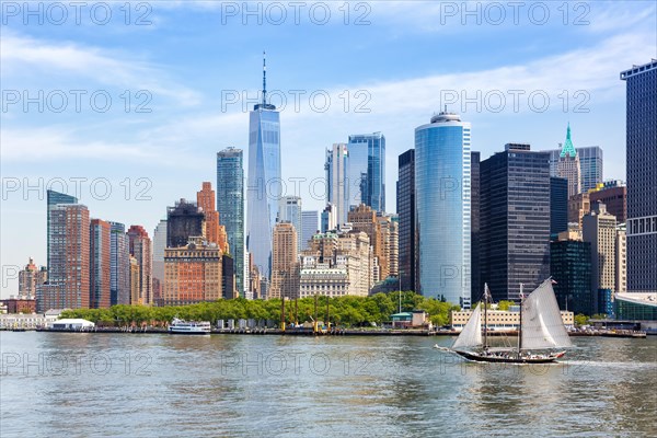 New York City Manhattan skyline with World Trade Center skyscraper and sailing ship in New York
