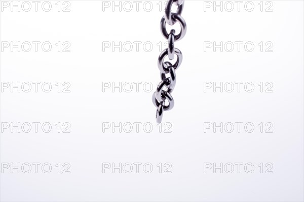 Metal chain on white background