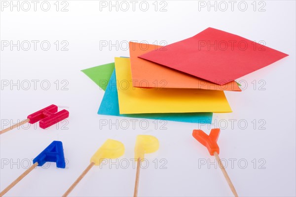 Colored envelopes and Color candles on sticks write happy