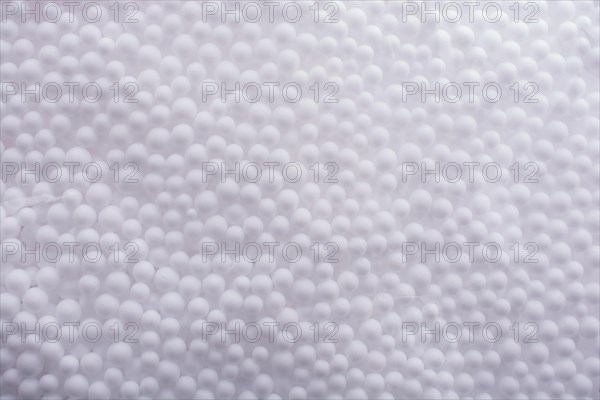 White little polystyrene foam balls as background