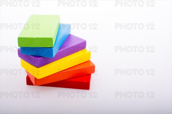 Colorful Domino Blocks in a line on a white background