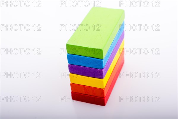 Colorful Domino Blocks in a line on a white background