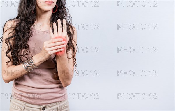 Girl suffering with joint pain of hands. People with arthritis and hand pain isolated. Woman suffering from arthritis in her hands