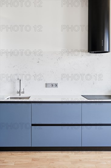 A modern kitchen with gleaming household equipment