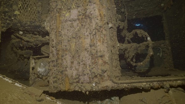 Close-up of truck cab lying on its side inside hold of ferry Salem Express shipwreck