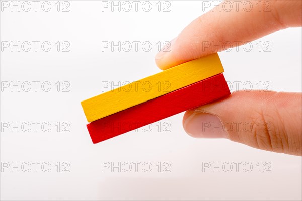 Colorful Domino Blocks in a line on a white background