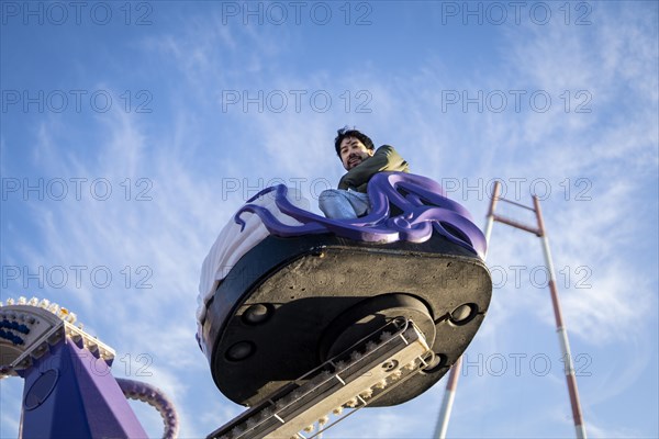 Latin man having fun at an amusement park