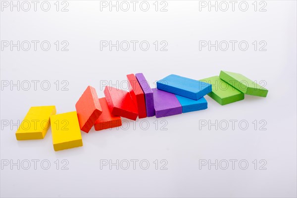 Colorful Domino Blocks in a line on a white background