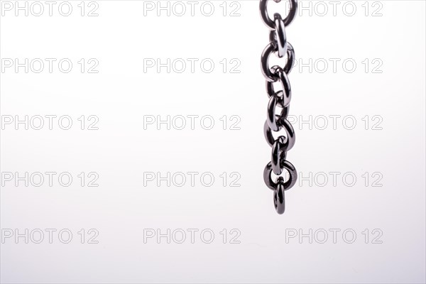 Metal chain on white background