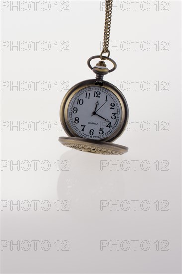 Isolated retro styled pocket watch on white background