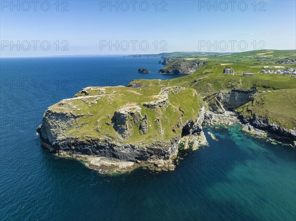 Aerial view of the rugged coastline on the Celtic Sea with the Tintagel Peninsula and the ruins of Tintagel Castle