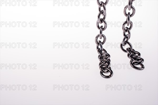 Metal chain on white background