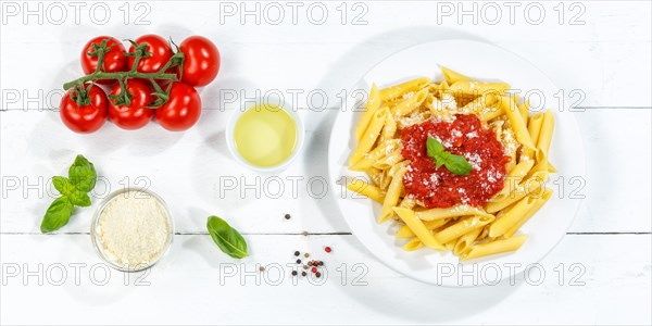 Penne Rigatoni Rigate Italian pasta in tomato sauce eat lunch dish on plate from above Panorama in Stuttgart